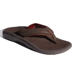 Free shipping and returns on OluKai Hokua Flip Flop (Men) (Regular Retail Price: $69.95) at Nordstrom.com. Thick, soft straps top a contoured flip flop designed for durability and comfort. Brown Cushioned Flip Flops For Surfing, Brown Synthetic Slippers With Arch Support, Brown Flip Flops With Ortholite Insole, Brown Synthetic Flip Flops For Outdoor, Brown Textured Flip Flops For Outdoor, Brown Textured Footbed Flip Flops For Outdoor, Comfortable Non-slip Leather Flip Flops, Brown Beach Flip Flops With Arch Support, Brown Flip Flops With Arch Support