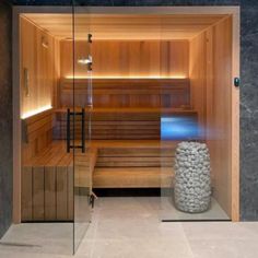 the inside of a sauna with rocks in it