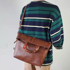 Material: PU
Texture: Soft
Closed: Zipper
Size: 15.75"L x 3.15" W x 14.96"H in; It is enough to hold daily stuff including cell phones, sunglasses, wallet, key, etc.
Baldric: Adjustable shoulder strap Brown Chest Bag For Daily Use, Versatile Adjustable Shoulder Bag For On-the-go, Casual Laptop Bag With Luggage Sleeve For On-the-go, Brown Large Capacity Chest Bag For Everyday, Large Capacity Tote Chest Bag For Travel, Everyday Large Capacity Brown Chest Bag, Everyday Brown Chest Bag With Zipper Pocket, Multifunctional Laptop Bag With Luggage Sleeve, Multifunctional Rectangular Laptop Bag With Luggage Sleeve