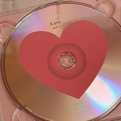 a cd with a pink heart on it