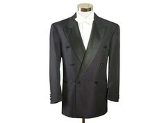 "Size: 42S / 42 Short US/UK This European vintage double-breasted dark purple tuxedo jacket has wide black peak lapels and padded shoulders and closes in the front with one black silk button (six in total show on the front). The retro formal dinner jacket has three pockets on the front and is crafted from a high-quality lightweight polyester-wool blend fabric with a diamond weave. The tux jacket is lined in a black satin viscose fabric (with four inner pockets). Note that this is a \"short\" size, which means the sleeves and the jacket length itself are slightly shorter than a regular 42. Exact measurements below. Brand label: Scherfig (Germany) Material: Polyester, Wool Condition: Excellent (Professionally Cleaned ... soft and supple, with no stains, tears, wear spots, or weaknesses in th Black Double Breasted Long Sleeve Suit For Evening, Black Double Breasted Suit With Long Sleeves For Evening, Black Double Breasted Suit With Double Button For Evening, Black Double Breasted Suit For Evening, Formal Tuxedo Blazer With Double-breasted Button Fastening, Formal Long Sleeve Tuxedo With Double-breasted Button, Formal Tuxedo Style Double-breasted Blazer, Double-breasted Long Sleeve Tuxedo For Business, Long Sleeve Double-breasted Business Tuxedo