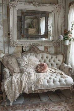 an old fashioned couch in front of a mirror