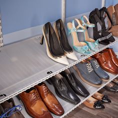 several pairs of shoes are lined up on a shelf