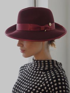 A timeless chic Trilby featuring a tonal satin hat band and inner petersham ribbon. Handcrafted in wool felt with a wired brim for fashioning to suit. Maximum size 57cm. Inside adjuster for one size fits all. Burgundy Hat, Trilby Hat, Timeless Chic, Hat Band, Wool Felt, One Size Fits All, Hats For Women, Felt, Ribbon