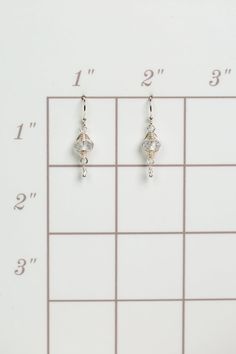 A beautiful gift for those born in April, featuring their birthstone of stunning quartz that is hand wrapped in sterling silver wire. These feminine earrings dangle from sterling silver earwires. Sterling Silver (lead and nickel free) Quartz .75", on sterling silver earwires We hand select our natural materials, thus there may be slight variations in color and/or size that will not detract from the overall aesthetic Our unique handcrafted designer jewelry for women is made in America, with each Sterling Silver Wire Wrapped Crystal Earrings, Nickel Free Silver Teardrop Wrap Earrings, Sterling Silver Wire-wrapped Crystal Drop Earrings, Nickel-free Silver Teardrop Wrap Earrings, Silver Nickel-free Teardrop Wrap Earrings, Everyday Silver Dangle Crystal Earrings, Silver Wire Wrapped Drop Earrings, Hypoallergenic Silver Wrap Earrings In Sterling Silver, Silver Crystal Earrings With Ear Wire For Everyday