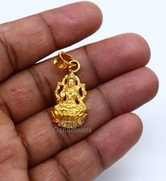 925 sterling silver handmade custom design vintage antique style Indian Hindu Goddess Laxmi pendant, this is special leaf Ganesh design pendant, best wishes blessing gift for your special person, excellent jewelry from India. Metal-925 sterling silver. Item type-Pendant. Length-3.8 centimeters. Width-1.5 centimeters. Weight-4.250 grams. Stamped-925. Finish-Gold polished over 925 silver Make excellent gifting and collectible pieces(gift for birthday, wedding, anniversary, mother's day, fathers da Laxmi Gold Pendant, Gold Plated Pendant Jewelry For Puja, Gold Plated Pendant For Puja, Festival Yellow Gold Jewelry With Large Pendant, Gold Locket Jewelry For Diwali, Yellow Gold Locket Jewelry For Festivals, Gold Plated Locket For Puja, 22k Gold Temple Jewelry As A Gift, 22k Gold Temple Jewelry Gift