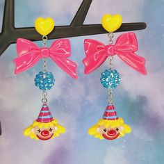 Bright and colorful party hat clown earrings - Halloween earrings - Circus jewelry - carnival - Lolitafashion earrings - post dangle earrings The perfect earrings for clowning around! Makes a great gift idea as well. Both wide plastic and silicone rubber backings included for comfort (pictured with plastic backings) **Stainless steel earring posts are hypoallergenic and nickel free Made of resin / plastic Charms are one sided and flat on the back Earring length is: 3 1/4" (in) Earring width is: Novelty Multicolor Earrings For Birthday, Yellow Novelty Jewelry For Party, Fun Dangle Earrings For Party, Adjustable Fun Party Earrings, Playful Multicolor Earrings For Birthday, Cute Halloween Party Jewelry, Pink Novelty Earrings For Party, Cute Plastic Party Earrings, Playful Pink Earrings For Party