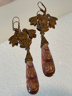 Vintage Czech Art Nouveau Earrings Circa 1920-1930's from the Czech Republic.  This vintage piece is made with brass and Czech glass which is cast into molds and fashioned into pieces of jewelry.  The pieces I have listed for sale have natural wear from time as they are not reproductions.   The earrings measure 5 inches and weighs .7 oz. each (with a lever back closure measuring 3/4 inch). Thank you for looking! Art Deco Brass Jewelry With Matching Earrings, Vintage Ceremonial Drop Earrings, Vintage Drop Earrings For Ceremonial Occasion, Victorian Gold Plug Earrings, Handmade Vintage Bronze Plug Earrings, Handmade Bronze Vintage Plug Earrings, Art Deco Brass Jewelry With Vintage Charm, Antique Brass Drop Earrings, Brass Art Deco Jewelry With Vintage Charm