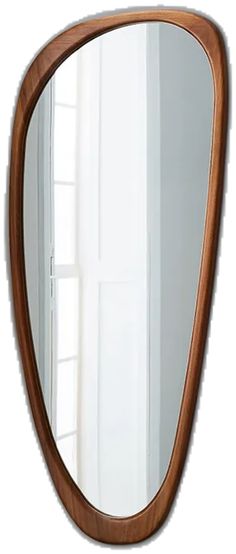 a large wooden mirror sitting on top of a wall