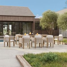 an outdoor dining table and chairs near a pool