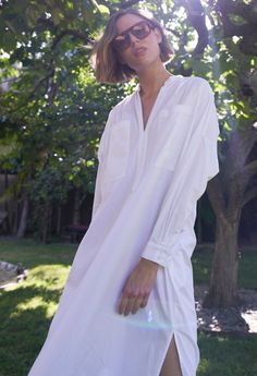 Eco friendly caftans and tunics inspired by the ocean, made on main street. Ethically sourced and locally made in Los Angeles. Inspired by French-girl chic and summers on the Cote d'Azur, meet our new favorite dress. Part shirt, part dress, part mens-wear inspired tunic, we love the oversized pockets, delicate pleats at the shoulder and generous cut. Like the majority of our dresses, this one has functional pockets, too. The cotton poplin is super soft and packs like a dream. With a shirt tail hem, pair this one with sandals or sneakers for elevated lounging or perusing your favorite market (whether its your local grocer or far away exotic bazaar). INSIDER TIP: This one is cut VERY roomy so please check the sizing tab for the best fit. Sheerness: noneFabric: 100% CottonMachine wash, hang, Summer V-neck Relaxed Fit Tunic, Chic Oversized Shirt Dress For Summer, Elegant Relaxed Fit Shirt Dress For Vacation, Elegant Vacation Shirt Dress With Relaxed Fit, Elegant Oversized Shirt Dress For Beach, Spring Relaxed Fit Tunic Shirt Dress, Daywear Relaxed Fit Tunic With Split Neck, Relaxed Fit Tunic Shirt Dress For Spring, Relaxed Fit Split Neck Tunic For Daywear