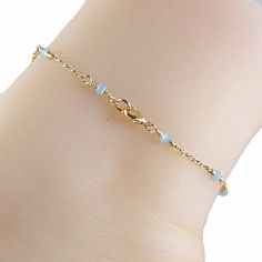 Dainty Blue Chalcedony Anklet Gorgeous blue bead gold chain anklet made with small blue chalcedony gemstones that are a lovely blue green shade, and 14k gold filled chain. The anklet has a 14k gold filled lobster clasp. Choose the size anklet you need from the drop-down menu, bearing in mind that the anklet should be approximately one inch larger than the size of your ankle. The anklet will arrive in an attractive gift box. Click here for this anklet with a sterling silver chain Gold Chain Anklet, Blue Anklet, Gold Anklet, Chain Anklet, Blue Chalcedony, Anklet Jewelry, Ankle Bracelets, Gold Filled Chain, Blue Beads