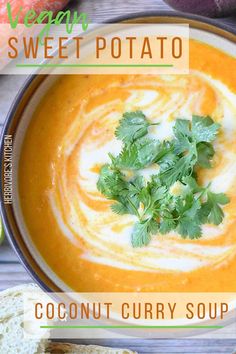 a bowl of creamy sweet potato soup with cilantro and parsley