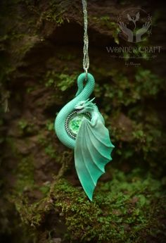 🏰Embark on a journey into the realm of enchantment with this cute mint dragon necklace! This beautiful dragon pendant will serve you not just as an accessory, but as a wise guardian and spirit companion! 🔮Mint - a delicate blend of soft green and gentle blue, creates an atmosphere of tranquility and harmony between different elements. It symbolizes purity and new beginnings.  💖The pendant hangs delicately from a chain, allowing the small dragon to rest gracefully against your chest, always cl Mystical Handmade Green Jewelry, Handmade Mystical Green Jewelry, Whimsical Green Pendant Jewelry, Handmade Magical Style Green Jewelry, Handmade Magical Green Jewelry, Handmade Fantasy Green Necklaces, Handmade Green Fantasy Necklaces, Handmade Green Fantasy Necklace, Green Handmade Fantasy Necklace