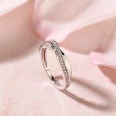 Simple in design, the ring is finished with a bright polished shine. Celebrate your commitment with this meaningful wedding band.Carat Weight: 0.29 ctStone Size: 1 mmStone Type: Jeulia® StoneNumber of Stones: 29 Stone Color: Diamond WhiteStone Shape: RoundWeight: 2.7 gWidth: 2.1 mmHeight: 2.3 mmThickness: 1.2 mmMaterial: 925 SilverPlating Color: Silver Minimalist Moissanite Ring For Anniversary, Elegant Cubic Zirconia Stackable Rings With Open Band, Minimalist Cubic Zirconia Rings With Tension Setting, Wedding Couple Rings With Brilliant Cut Cubic Zirconia, Diamond Crystal Ring With Half Eternity For Wedding, 14k White Gold Wedding Jewelry With Tension Setting, White Gold Stackable Open Ring With Half Eternity, White Gold Diamond Crystal Promise Ring, Cubic Zirconia White Gold Diamond Ring For Promise