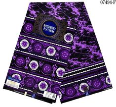 a purple and black tie with an ornate design