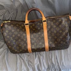 Brown Leather Designer Duffel Bag Luxury Brown Formal Duffle Bag, Luxury Brown Duffle Bag With Leather Lining, Brown Duffle Bag For On-the-go, Brown Soft Leather Duffle Bag For On-the-go, Brown Leather-lined Rectangular Duffle Bag, Duffel Bag, Brown Leather, Louis Vuitton, Man Shop