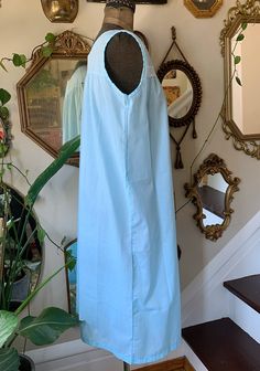 Darling vintage sky blue nightgown by Katz! No pockets, has a white lace trim along the front of the chest and embroidered flowers on the lace and 1 on the neckline. Marked a size medium. Is 65% polyester and 35% cotton. Still has wash care instructions. Overall good condition. Very minor wear. Bust: 40 inches Length: 40 and 1/2 inches Discounts offered for bulk purchases. Shop accepts PayPal, credit cards, and Etsy gift cards. ♥Check out the rest of the shop♥ https://www.etsy.com/shop/artdecoda Sleeveless Light Blue Sleepwear For Spring, Light Blue Sleeveless Sleepwear For Spring, Blue Cotton Nightgown For Spring, Light Blue Summer Nightgown For Bedtime, Blue V-neck Dress For Sleepover, Light Blue Lace Trim Dress For Loungewear, Blue Nightgown For Summer Daywear, Vintage Blue Dress For Sleepover, Blue Lace Trim Dress For Loungewear