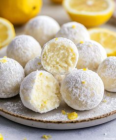 a white plate topped with lemon covered donuts