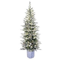 a white christmas tree in a blue vase