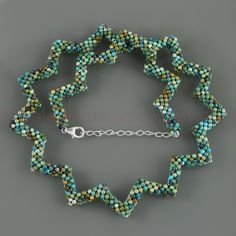 ★ Zigzag Necklace:-                          Length:- 18+2 Inches                          Stone Weight:- 92 Cts.                          Silver Weight:- 1.2 Grms. Adorn yourself with the timeless elegance of this exquisite Natural Turquoise Gemstone Handmade Woven Beaded Necklace. Crafted with care and skill, each bead is meticulously woven into a stunning 18-inch necklace, accented by a 925 Sterling Silver Chain that adds a touch of sophistication. With an additional 2 inches extender, this p Spiral Colorful Beads For Jewelry Making, Colorful Spiral Beads For Jewelry Making, Turquoise Gemstone Beads Bracelet, Turquoise Faceted Beads For Jewelry Making, Handmade Turquoise Spiral Jewelry, Turquoise Jewelry Bracelet With Faceted Beads, Turquoise Faceted Beads Bracelet, Unique Turquoise Faceted Beads, Handmade Spiral Turquoise Jewelry