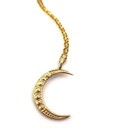 Our double sided Crescent Moon pendant is carved from a magnificent button from the 1880s. How lovely to think that this button, once a story of tight corsets is now a story of bold women like us. Unbuttoned and unbound. A perfect stand-alone statement piece or addition to your layering collection. 7/8" tall hand cast in 10k or 14k solid yellow gold this listing is for the pendant only. chain sold separately. Please note that our 14k gold items are custom made for you. Please allow 4-6 weeks if Crescent Moon Necklace Gold, Bold Women, Gold Items, Gold Moon Necklace, Crescent Moon Pendant, Crescent Moon Necklace, Hand Cast, Vintage Button, Moon Pendant