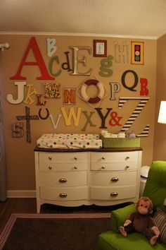 the baby's room is decorated with letters and numbers