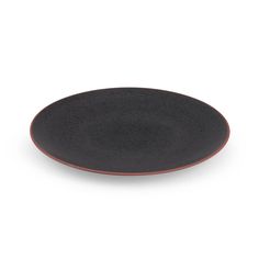 a black plate with red rim on a white background, there is no image to describe