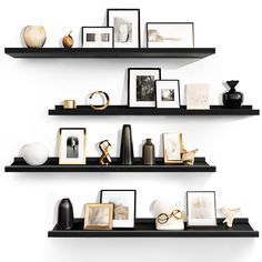 three black shelves with pictures and other items on them