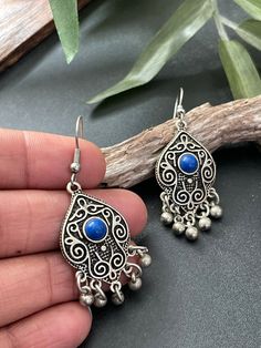 Indus Earrings : Back to our Roots. For the women who makes a statement.  An exclusive shop for earrings. Wear them with pride.  These are dangling drops style earrings . An unique handmade Indian style ethnic bohemian/ Tribal earrings in silver shade with blue enamelled .  These earrings are made from high quality Tatanium / German silver material  which are hypoallergenic and free from corrosion & rusting. An uniquely crafted dangling drops earrings in blue  Notes : The product shipped will be Moroccan Jewelry Silver, Bohemian Drop Earrings, Blue Metal Earrings With Latkans, Metal Teardrop Danglers, Bohemian Dangling Beads Drop Earrings, Bohemian Metal Plug Earrings With Ear Wire, Bohemian Earrings With Latkans, Bohemian Metal Plug Earrings For Pierced Ears, Silver Teardrop Beaded Earrings Bohemian Style