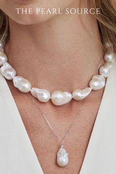 female wearing to pearl necklaces. one pearl necklace has large pearls, baroque pearls the other pearl necklace is a single pearl. pearl necklaces for women. pearl necklace design. This strand is absolutely gorgeous and represents the finest of the finest for Freshwater pearls. This strand also includes rare and large pearls, with a centerpiece that measures at 16mm. AAA quality pearls with a high level of luster bring out the beauty of this gorgeous pearl necklace. Fine Jewelry Briolette Pearl Necklace, Classic Pear-shaped Baroque Pearl Necklace, White Gold Pearl Necklace With Pear-shaped Charm, Luxury Pear-shaped Pearl Drop Necklace, White Gold Pear-shaped Pearl Necklace With Charm, Classic Teardrop Baroque Pearl Necklace, Pear-shaped White Gold Pearl Necklace With Charm, White Gold Pearl Charm Necklace, Classic Baroque Pearl Pear-shaped Necklace