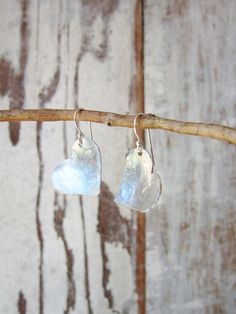 "I cut these two free form hearts from a sheet of sterling silver metal and hammered them to create these rustic earrings. They are coated to prevent tarnishing. The hearts have a slight curve to them to pick up shine from the hammered indensions. They measure 1 1/4\" in length from the top of the sterling silver earwire. Very lightweight and comfortable for all day wear. See the longer heart version here: https://www.etsy.com/listing/129416439/valentines-gift-sterling-silver-heart?ref=shop_home Hammered Silver Heart Jewelry, Heart-shaped Hammered Sterling Silver Jewelry, Sterling Silver Earrings For Anniversary Gift, Silver Sterling Silver Earrings For Anniversary Gift, Silver Heart Earrings For Anniversary Gift, Sterling Silver Heart Earrings For Anniversary, Silver Heart Shaped Earrings For Anniversary, Silver Heart Earrings For Anniversary, Sterling Silver Heart Earrings