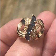 Nwot 14ky Blue Sapphire & Diamond Cocktail Ring, Set W/1.03ct Of Marquis Sapphires(Approx. 5.5x2.5mm) & .12ct. Of Round Diamonds, Size 6, Band Measures 2mm Wide, Top Of Ring Measures Approx. 17.64mm Wide $1295 Blue Diamond Ring With 14k Gold Accents, Pear-shaped Blue 14k Gold Ring, Blue Pear-shaped 14k Gold Ring, Blue Marquise Cut Jewelry With Diamond Accents, 14k Gold Blue Ring With Diamond Accents, Marquise Blue Ring In 14k Gold, Blue Marquise 14k Gold Ring, Blue Diamond Jewelry Stamped 14k, Blue Diamond Ring With Diamond Cut In 14k Gold