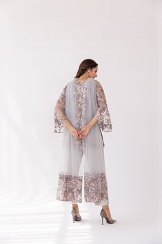 Featuring a silver embroidered boat neck kurta set in net base. It is paired with solid pants and net dupatta with sequin work. Color: SILVER FABRIC: NET Delivery time 15 to 20 days Eid Straight Kurta Palazzo Set With Sequins, Wedding Palazzo Set With Straight Kurta And Sequins, Wedding Palazzo Set With Sequins And Straight Kurta, Party Pant Set With Sheer Dupatta, Traditional Pant Set With Sheer Dupatta For Party, Elegant Straight Kurta Palazzo Set With Sequins, Elegant Palazzo Set With Sequins And Straight Kurta, Elegant Sequined Palazzo Set With Straight Kurta, Elegant Sequined Straight Kurta Palazzo Set