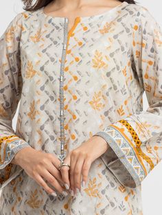 Brand: edenrobe Product: EWU24A1-28515-3PCollection: Allure Lawn Unstitched - Spring Summer CollectionFabric: Lawn DESIGN DETAILS: 3M Printed Lawn Shirt 2.5M Printed Lawn Dupatta 1.8M Dyed Trouser DISCLAIMER:* Lining, Laces, and Tassels are not included in unstitched variants.* Embellishment items in stitched outfits are subject to market availability.* The actual colors of the outfit may vary from the colors being displayed on your device. CARE INSTRUCTIONS: Extra Fabric Has Been Used For Shoot Original Color May Vary Slightly From The Picture Dry Clean Recommended Iron The Clothes At Moderate Temperature Do Not Use Bleach, Or Stain Removing Chemicals Damp Fabric Should Not Be Exposed To Sunlight edenrobe Allure Lawn Spring Summer Collection Authenticity Guaranteed – 100% Original Brand 3 Elegant Summer Unstitched Suit With Straight Kurta, Elegant Silk Lawn Suit With Digital Print, Formal Long Sleeve Palazzo Set With Naqshi Embroidery, Formal Long Sleeve Palazzo Set With Naqshi Detail, Formal Long Sleeve Palazzo Set With Naqshi, Elegant Summer Sets With Printed Motifs, Digital Print Cambric Salwar Kameez, Elegant Summer Palazzo Set With Printed Motifs, Festive Beige Digital Print Lawn Suit