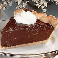 a piece of chocolate pie with whipped cream on top