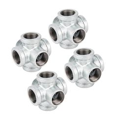 four stainless steel pipe fittings on a white background