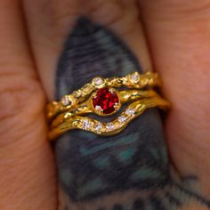 Introducing our elegant Magnolia ring solitaire. We offer this as made to order with a selection of 22 gemstones which can be found here (shown is an example of 14K yellow gold with lab-grown ruby; the pictured ring is sold). Four double-prongs clasp a smaller 4mm round brilliant cut lab-grown ruby. This ring can be customized with diamonds set into the band (not pictured, please see our 22-gemstone made to order Magnolia ring listing for examples of side diamonds). -- Custom?: We can create you Yellow Gold Garnet Rings With Prong Setting, Yellow Gold Garnet Rings, Yellow Gold Garnet Rings With Round Cut, Yellow Gold Garnet Promise Ring, Fine Jewelry Red Birthstone Stackable Rings, Red Birthstone Stackable Rings Fine Jewelry, Yellow Gold Garnet Solitaire Jewelry, Ruby Ring In Yellow Gold With Bezel Setting, Yellow Gold Ruby Ring With Bezel Setting