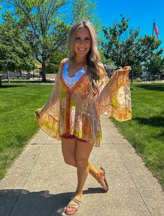 100% Polyester; This beautiful boho ruffle sleeve kimono will be your most versatile piece this season. Wear it over a tank dress with sandals or alone over your swimsuit. You can even pair this flowy separate with shorts and a bralette for a perfect feminine touch! Floral Print Beach Dress For Summer Festivals, Hippie Ruffle Dresses For Spring, Spring Boho Floral Print Dress For Beach, Floral Print Boho Dress For Summer Festival, Summer Festival Boho Dress With Floral Print, Multicolor Flowy Beach Dress For Spring, Spring Hippie Dresses With Ruffles, Spring Multicolor Flowy Beach Dress, Bohemian Beach Dress With Kimono Sleeves For Summer