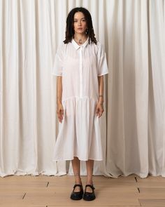 Slightly sheer oversized button-down dress with collar and drop waist full skirt in great viscose fabric. CONTENT & CARE:68% Viscose, 32% NylonHang wash cold, Lay flat to dry MEASUREMENTS (laying flat):XS/S - Chest: 25”, Length (Shoulder to hem): 43”, Bottom Width: 48”M/L - Chest: 26”, Length (Shoulder to hem): 44”, Bottom Width: 49" Collared Maxi Dress For Summer Daywear, Oversized Summer Shirt Dress For Daytime, Oversized Shirt Dress For Summer Daytime, Relaxed Fit Smock Dress For Daywear, Short Sleeve Relaxed Fit Dresses For Daytime, Flowy Buttoned Midi Dress For Daywear, Daytime Dresses With Relaxed Fit And Short Sleeves, Relaxed Fit Short Sleeve Dresses For Daytime, Flowy Short Sleeve Shirt Dress