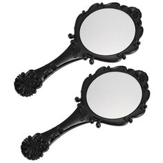 two black ornate mirrors on a white background