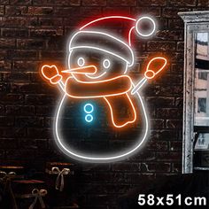 a neon sign with a snowman on it in front of a brick wall and window