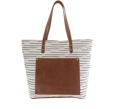 This trendy textile tote features a rich, full grain leather trim, plus leather bottom and straps for long-lasting wear. The spacious interior provides two zippers and accessory pockets, while a distinctive exterior leather pocket separates Shelby from your everyday totes, and keeps your phone and keys more readily at hand.
Handcrafted in the U.S.A. (15.00"W, 12.00"H, 6.00"D) On-the-go Satchel Bag With Leather Trim, Travel Weekender Bag With Coated Canvas Handles, On-the-go Bucket Bag With Leather Handles, Chic Canvas Weekender Bag With Double Handle, Everyday Coated Canvas Tote Weekender Bag, Coated Canvas Tote Weekender Bag, On-the-go Travel Bag With Leather Trim And Double Handle, Coated Canvas Weekender Tote Bag, Chic Coated Canvas Bag For On-the-go