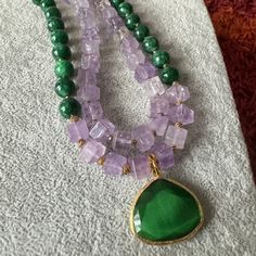 Elevate your style with our Amethyst and Jade Necklace – a unique green gemstone piece crafted for women. This handmade necklace makes a perfect birthday or anniversary gift for your wife,mom,sister or girlfriends. Explore the beauty of beaded jewelry and treat her to a truly special accessory. I use these pieces: - 10 mm jade and amethyst stones,- Small gold color hematite stones,- Cat eyes pendant. -18inches Amethyst Stones, Hematite Stone, Jade Necklace, Cat Eyes, Mom And Sister, Green Gemstones, Amethyst Stone, Handmade Necklace, Perfect Birthday