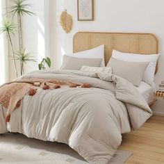 a bedroom with a bed and pillows on the floor