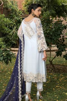 Elegant Chiffon Party Dress In White Color is a beautiful attire and a modern pick if you are looking for Pakistani Party Dresses. This ethereal white dress with its pretty adornments is perfect to style on any special event or party making you the center of the event. Kameez: This ethereal white Long Kameez comes in fine quality chiffon imparting it dreamy insights. This Pakistani Dress is adorned with fine embroidery and tilla in floral patterns. This kameez is very elegant because of its soft Festive Reception Dress With Sheer Sleeves, Blue Organza Dress For Wedding Guest, Summer Wedding Chiffon Dress In Georgette, Festive Sheer Georgette Dresses, White Chiffon Dress For Summer Evening, White Chiffon Evening Dress For Summer, Blue Chiffon Summer Wedding Dress, White Chiffon Summer Evening Dress, White Fitted Chiffon Party Dress