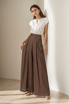 You can Pair them with a fitted top for a balanced look. Elevate your wardrobe - experience the blend of luxury and comfort with our linen wide-leg pants. DETAILS: * 100% linen, the wide-leg pants is made from high-quality linen, providing a breezy and comfortable feel. * Two side pockets * Zipper and button front closure * Pleated detail * High waisted pants * Wide leg pants * Perfect for spring, summer * Dry clean MODEL SIZE Bust 85 cm(33.4") Waist 67 cm(26.7") Height 168cm (5' 6") She wears s Wide Leg Pants Outfit With Heels, Wide Pant Leg Outfit, Pant Trousers Women Outfit Wide Leg, Split Side Pants, Linen Pants Women Summer, Square Pants Outfit Classy, Pants Details Women, High Waist Linen Pants, Tops For Trouser Pants