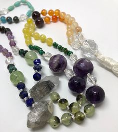 Is it a chakra mala? Is it a pride mala? Is it just a bunch of pretty gems from mama nature? You decide. This mala necklace has all the colors of the rainbow and balancing energy for the whole chakra system. It absolutely has 108 beads, so you could use for meditation, but it's important to note that they're all different shapes and sizes, so that may or may not be a concern for you. Also, there's a section of tiny little turquoise guys that are in pairs, so it would take a little extra concentr Bohemian Rainbow Crystal Necklaces For Healing, Rainbow Gemstone Beaded Necklaces For Healing, Rainbow Beaded Spiritual Crystal Necklaces, Spiritual Rainbow Beaded Necklace For Gift, Spiritual Rainbow Beaded Necklaces With Natural Stones, Spiritual Multicolor Beaded Necklaces For Rituals, Spiritual Rainbow Beaded Necklace As Gift, Spiritual Beaded Rainbow Crystal Necklaces, Spiritual Style Beaded Rainbow Crystal Necklaces