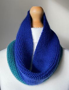 A super soft & cosy cowl, handmade with premium merino wool in blue and green. Size: 20cm wide and 62cm around. Care: hand wash in cool water & lay flat to dry. Blue Knitted Scarves For Winter, Blue Knitted Winter Scarves, Blue Knitted One-size Scarf, Blue Knitted Scarves One Size, Blue Knitted Scarf One Size, Blue Knitted Scarf, One Size, Blue Hand Knitted Scarf, Cozy Blue Scarf One Size, Handmade Blue Casual Scarves