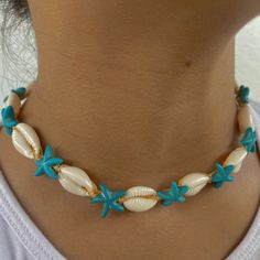 🐚 Embrace Bohemian Elegance! Introducing our Beige Adjustable Cowrie Shell with Turquoise Starfish Choker, a unique and stylish piece meticulously handcrafted to bring a touch of bohemian elegance to your style! This necklace is a true reflection of a love for the beach, symbolizing adventure, freedom, and a deep connection with nature. 🌊 Inspired by the Beauty of the Ocean: Crafted with a passion for the serene beauty of the ocean and the elegance of natural elements, this necklace is a celebration of adventure, tranquility, and the timeless beauty of nature. It's a versatile accessory for those who appreciate chic elegance and the calming ambiance of the beach. 🌟 Unique & Trendy Design: With its distinctive cowrie shell, turquoise starfish, and adjustable design, this choker is a tren Starfish Jewelry For Vacation, Bohemian Starfish-shaped Turquoise Jewelry, Bohemian Turquoise Starfish Jewelry, Bohemian Light Blue Jewelry For Vacation, Blue Star Jewelry For Vacation, Blue Star Shaped Jewelry For Vacation, Blue Jewelry For Summer Vacation, Summer Vacation Starfish Jewelry, Summer Vacation Blue Jewelry